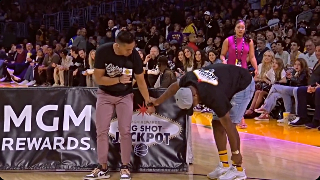 A Lakers Fan Had To Be Helped Off The Floor After A Halfcourt Shot Injury