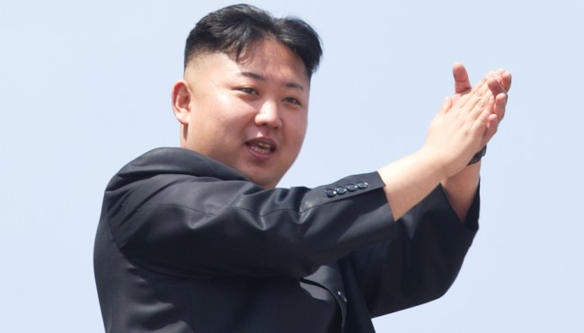 North Korean leader Kim Jong-Un (L) appl