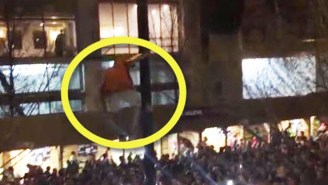 Check Out This Crazy Wisconsin Fan Jumping Off A Light Post