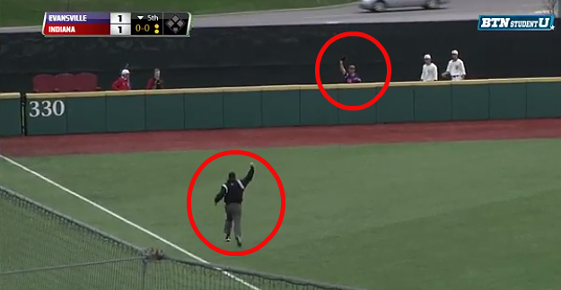 Watch This Outfielder Flip Over A Wall To Rob A Home Run