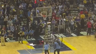 Watch The Memphis Grizzlies Mascot Jump Off A Ladder And Put The Blazers Mascot Through A Table