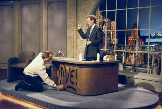 NEW YORK - AUGUST 30: Bill Murray spray paints Dave's desk on the first taping of the Late Show with David Letterman, August 30, 1993 on the CBS Television Network. This photo is provided by CBS from the Late Show with David Letterman photo archive. (Photo by Alan Singer/CBS via Getty Images)