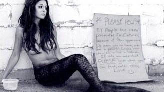 What’s Up With This Photo of Emmanuelle Chriqui Dressed Up As A Homeless Mermaid?
