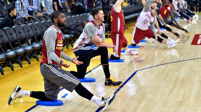 Jun 3, 2015; Oakland, CA, USA; Cleveland Cavaliers guard Kyrie Irving (2) stretches during practice prior to the NBA Finals at Oracle Arena. Mandatory Credit: Bob Donnan-USA TODAY Sports