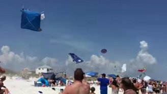 Watch A Blue Angel Do A Low-Pass Over A Beach, Sending Tents And Umbrellas Flying