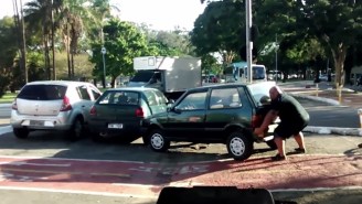 Watch This Strong Man Lift A Parked Car Out Of A Bicycle Path