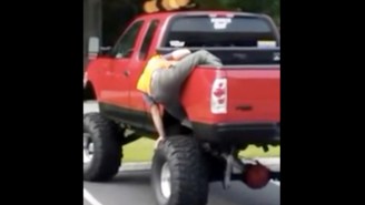 This Drunk Guy Attempting To Climb Out Of The Back Of His Truck Is Performance Art
