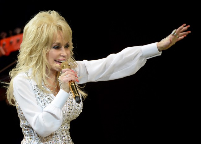 KNOXVILLE, TN - MAY 28: Dolly Parton performs during a concert to benefit Dolly's Imagination Library & Dr. Robert F. Thomas Foundation at The University of Tennessee's Thompson-boling Arena on May 28, 2014 in Knoxville, Tennessee. (Photo by Rick Diamond/Getty Images)