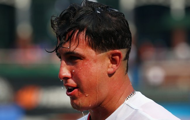 Texas Rangers' Derek Holland is sporting a 'Wild Thing' haircut