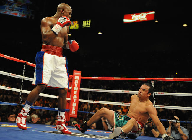 Floyd Mayweather Jnr. (L) of the US knoc