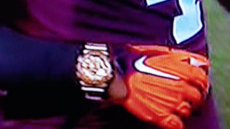 A Virginia Tech Player Is Wearing A Gold Watch During Game Action Against Ohio State