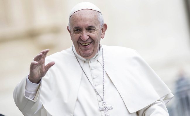 Pope Francis blesses the faithful as he attends Weekly