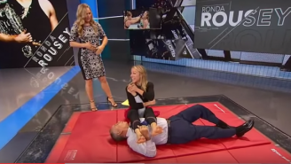‘SportsCenter’ Host Ronda Rousey Shows Proper Armbar Technique On Tim Kurkjian