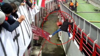 Watch This Clever Soccer Hooligan Get Some Help From The Crowd To Slip Away From Security
