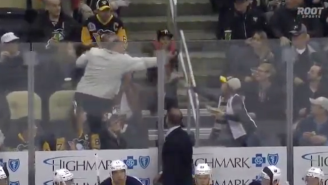 This Old Man Stealing A Puck From A Small Child Is The Worst Hockey Fan