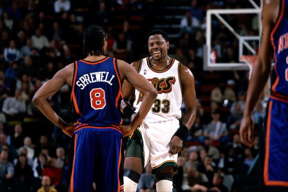 SEATTLE - 2001: Patrick Ewing #33 of the Seattle SuperSonics talks with Latrell Sprewell #8 of the New York Knicks during an NBA game at the Key Arena in Seattle, Washington. NOTE TO USER: User expressly acknowledges and agrees that, by downloading and or using this photograph, User is consenting to the terms and conditions of the Getty Images License Agreement. (Photo by Jeff Reinking/ NBAE/ Getty Images)