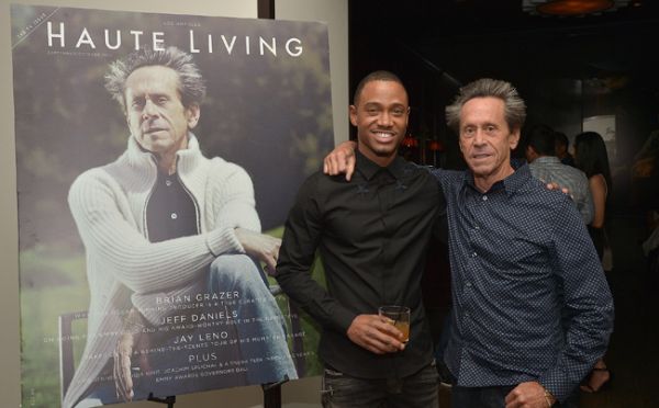 "Goddammit, Grazer! Stop smiling! 'Haute Living' is serious business!"