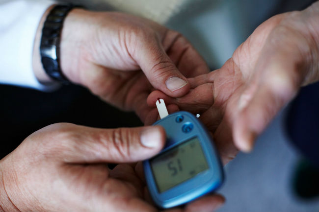 doctor conducting glucose test