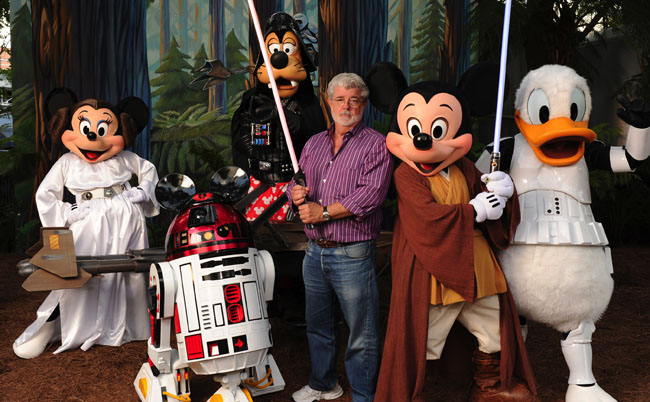 George Lucas Poses With A Group Of "Star Wars" Inspired Disney Characters At Disney's Hollywood Studios