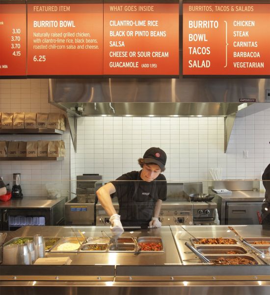 Kyle Braley stirs a tomatillo green chili salsa at Chipotle Mexican Grill in South Portland on Mond