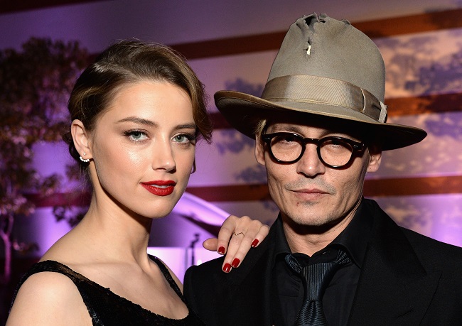 amber-heard-johnny-depp-amazing-hat_getty-resized LOS ANGELES, CA - JANUARY 11: Actors Amber Heard (L) and Johnny Depp attend The Art of Elysium's 7th Annual HEAVEN Gala presented by Mercedes-Benz at Skirball Cultural Center on January 11, 2014 in Los Angeles, California. (Photo by Michael Kovac/Getty Images for Art of Elysium)