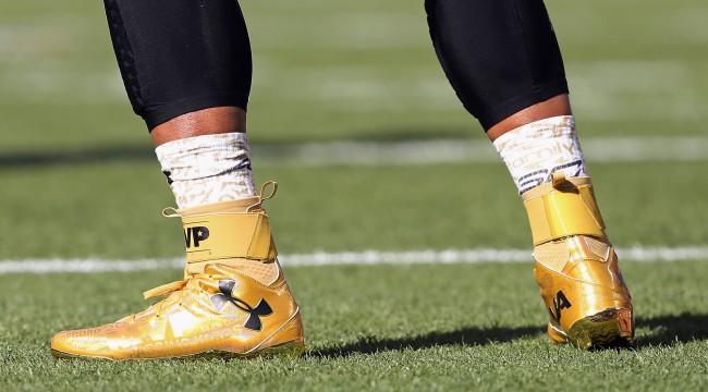 black and yellow cam newton cleats