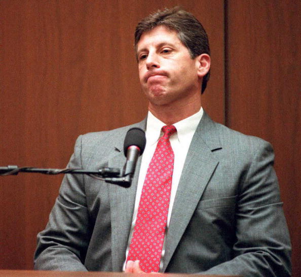 Los Angeles Police detective Mark Fuhrman listens