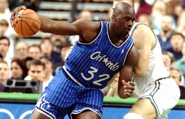 Shaquille O'Neal of the Orlando Magic drives past