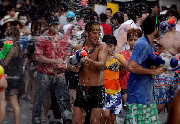 Red Shirts & Tourists Celebrate Thai New Year Amid Political Instability