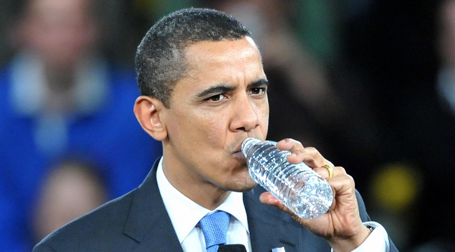 US President Barack Obama takes a sip of