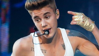 Justin Bieber outsmarted by shirt, falls off stage