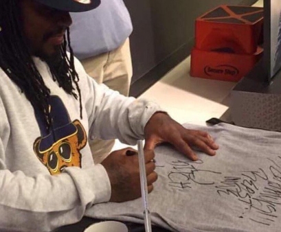 NFL on Twitter: Marshawn Lynch signed this dude's @Patriots tee Seahawks.  Beast Mode U Bitch.  / Twitter