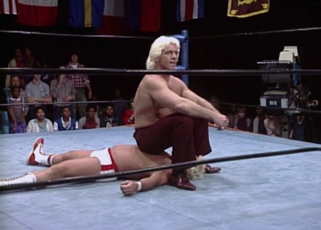 Ric Flair sits on Ron Garvin