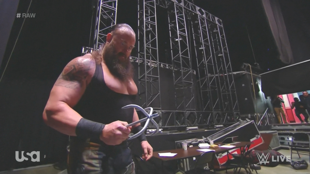 Braun Strowman drives Kane through the ring: photos