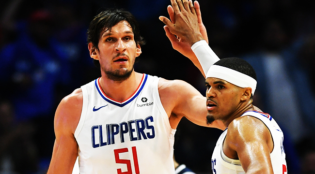 Tobias Harris and Boban Marjanovic of the LA Clippers exchange