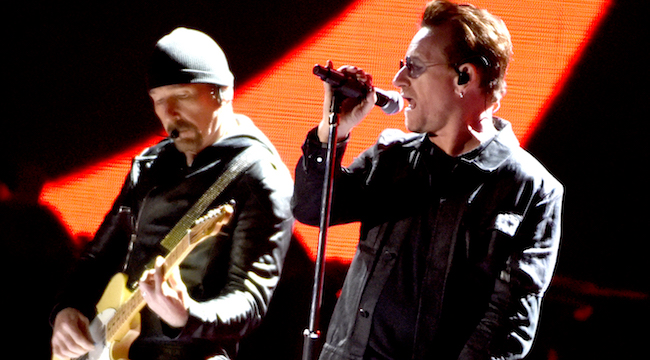 [WATCH] U2's Bono And The Edge Busk For A Charity On Christmas Eve