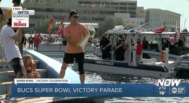 Tom Brady throws Lombardi Trophy from one boat to another during