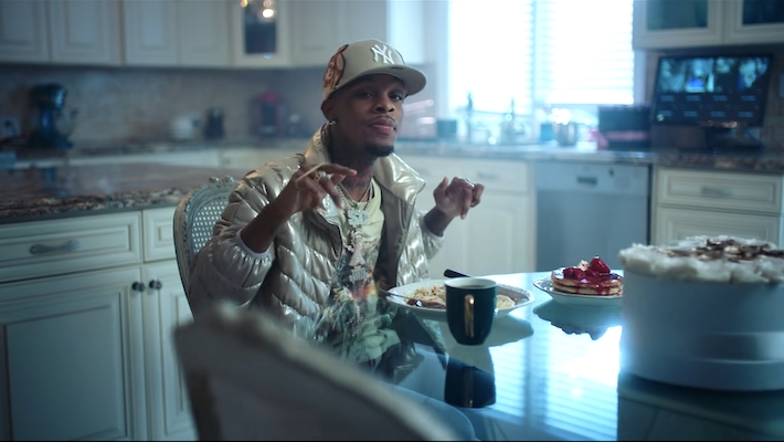 Toosii controls the shortcomings of fame in his 'Does It Cost' video