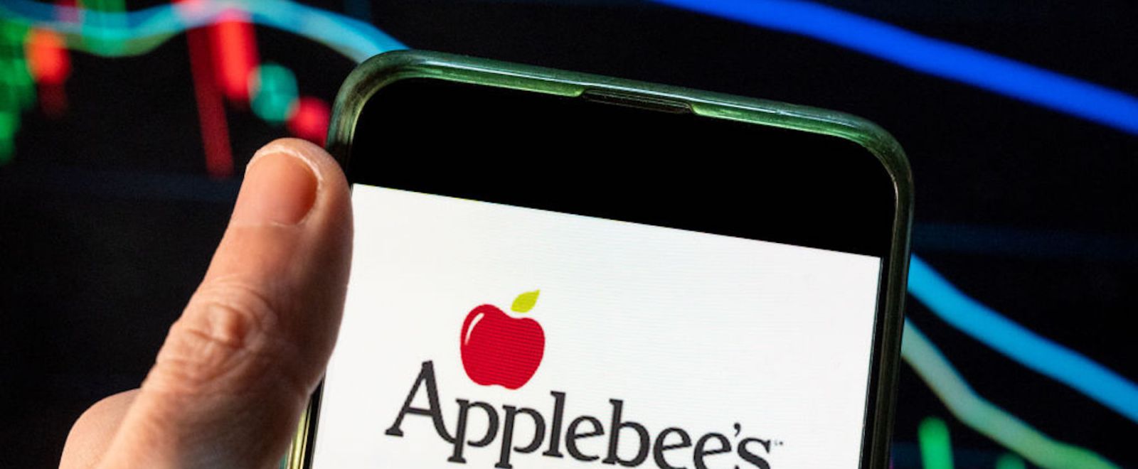 A person uses the Applebee's app on their phone