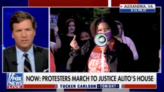 A Protestor Had Perfect Timing While Giving Tucker Carlson The Middle Finger On Fox News