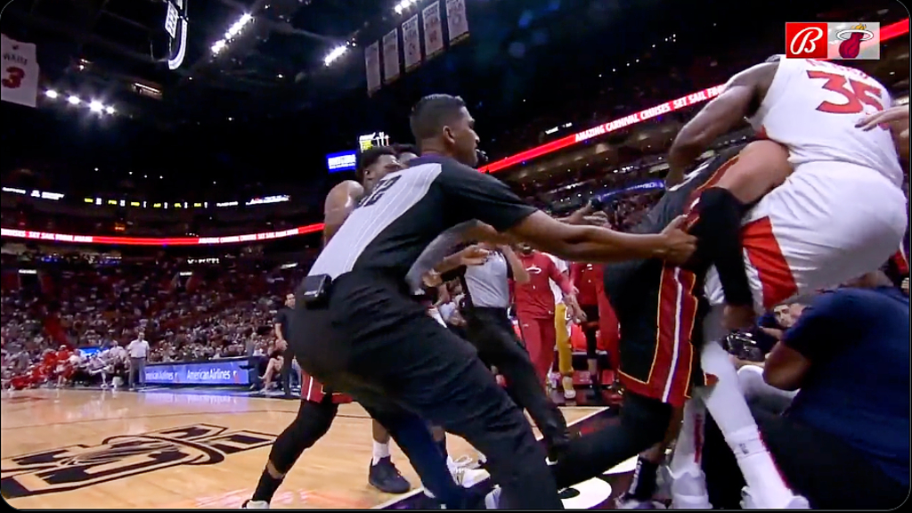 Heat's Caleb Martin tackles Raptors' Christian Koloko into stands