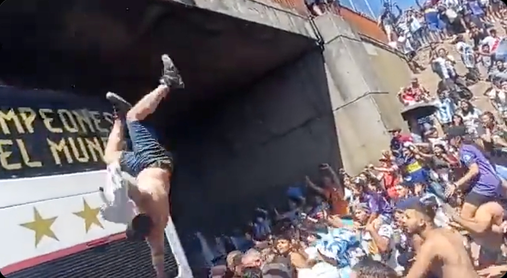 Argentina Fan Tries Jumping On Bus At Parade, Misses