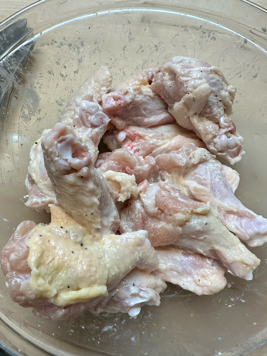 Cornstarch covered raw chicken Wings