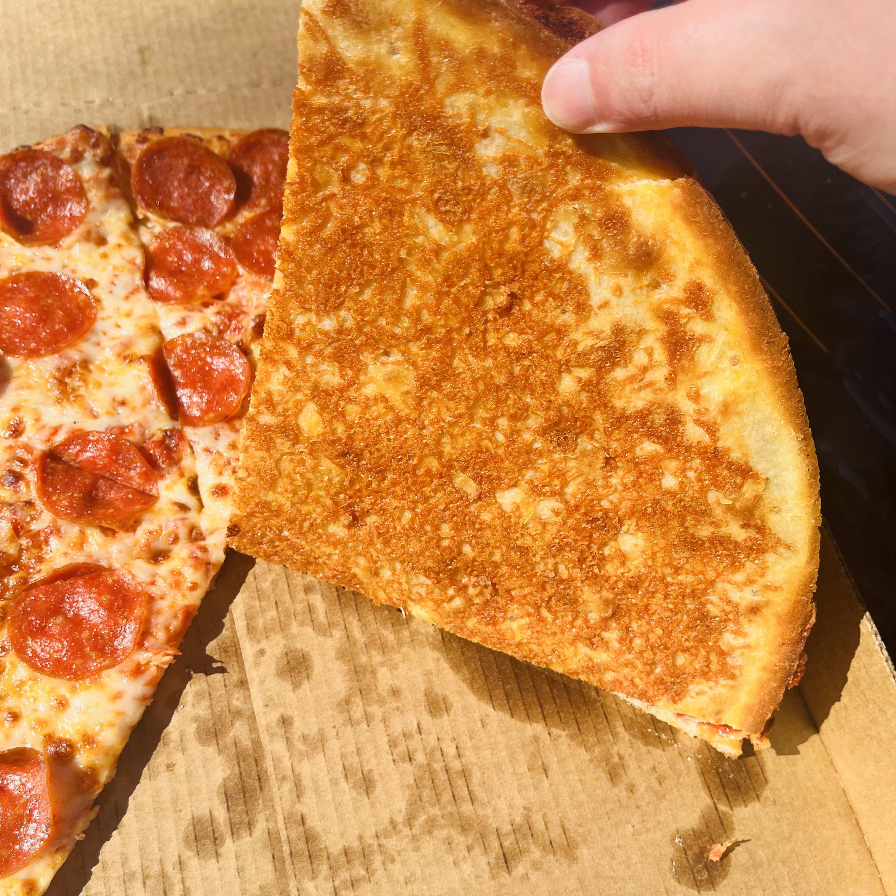 Papa Johns' New Crispy Parm Pizza Has Cheese At The Bottom