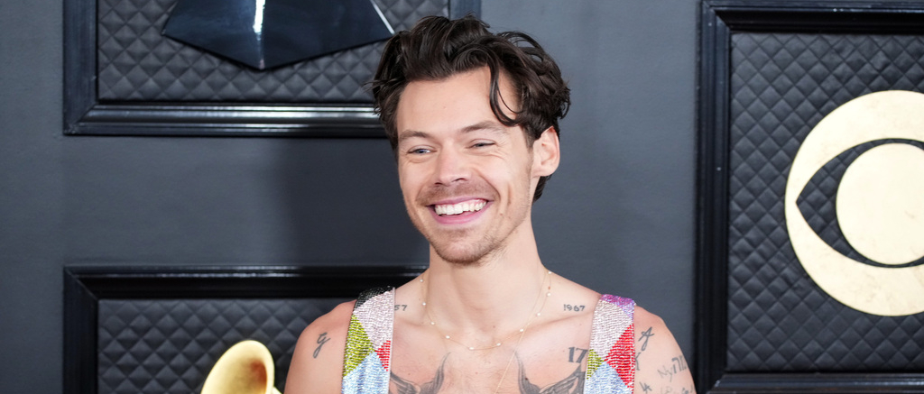 harry styles smiling at the camera 2022