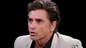 John Stamos Hilariously Called Out The Host Of ‘Hot Ones’ For Not Knowing About His Infamous Moment In Howard Stern’s ‘Private Parts’
