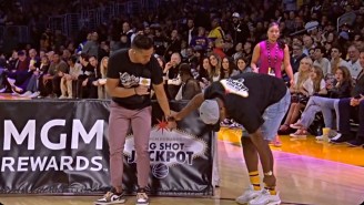 A Lakers Fan Had To Be Helped Off The Floor After Injuring Himself On A Halfcourt Shot