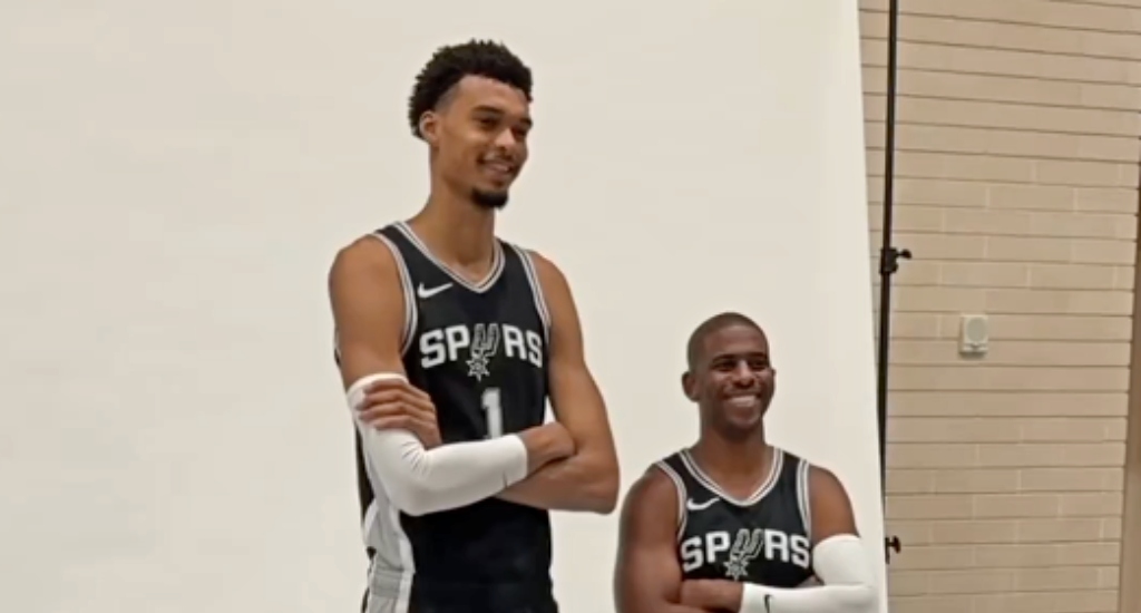 Victor Wembanyama towers over Chris Paul at the Spurs photoshoot