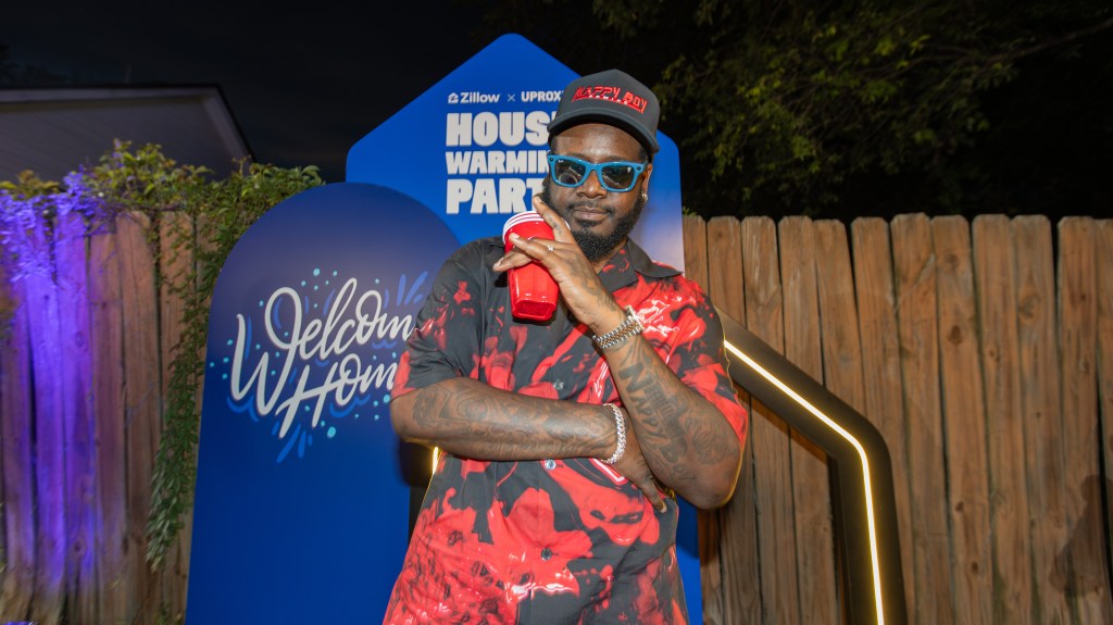 Watch T-Pain Surprise New Homebuyers With A Concert In Their Backyard #TPain