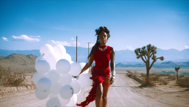 Sudan Archives Hitchhikes In Heels In Her Balloon-Filled ‘A Bug’s Life’ Video